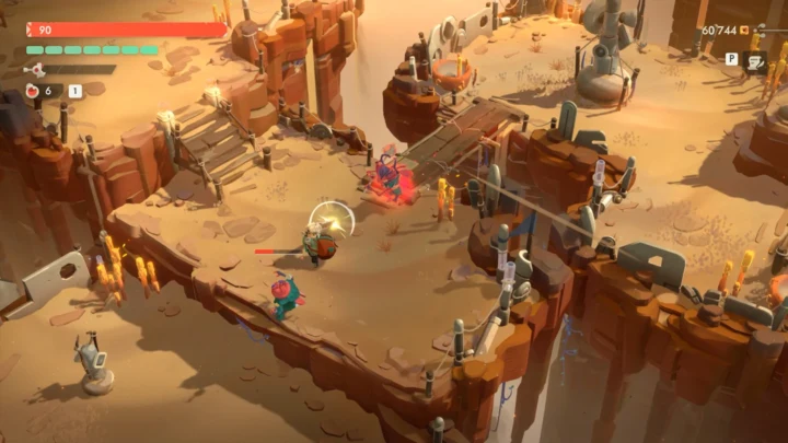 Cena de Moonlighter 2 mostrando Will de espada em punho enfrentando criaturas em um desfiladeiro de areia